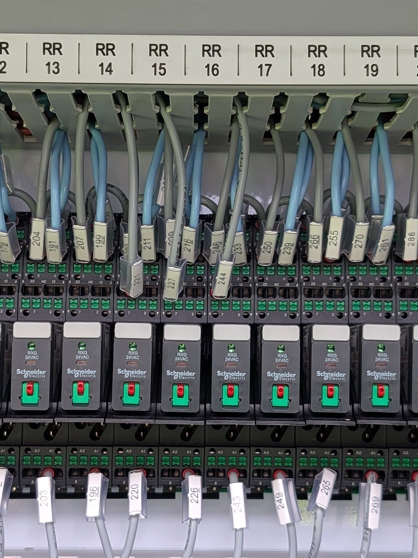 Interposing relays, terminal rails and numbered field wiring inside an ACE Electrics control board build